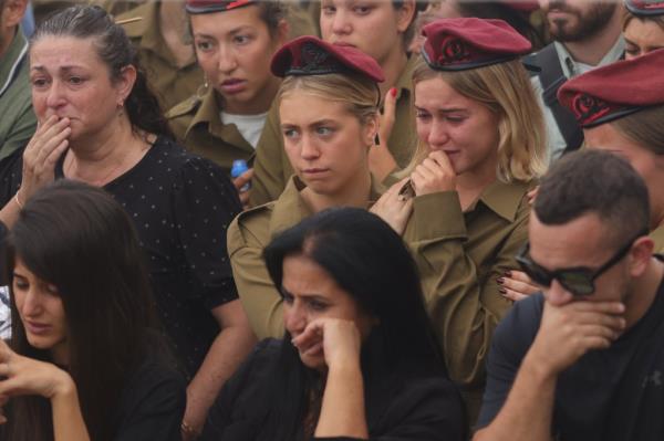 Israelis attend a funeral for a soldier who was killed fighting off Hamas forces.